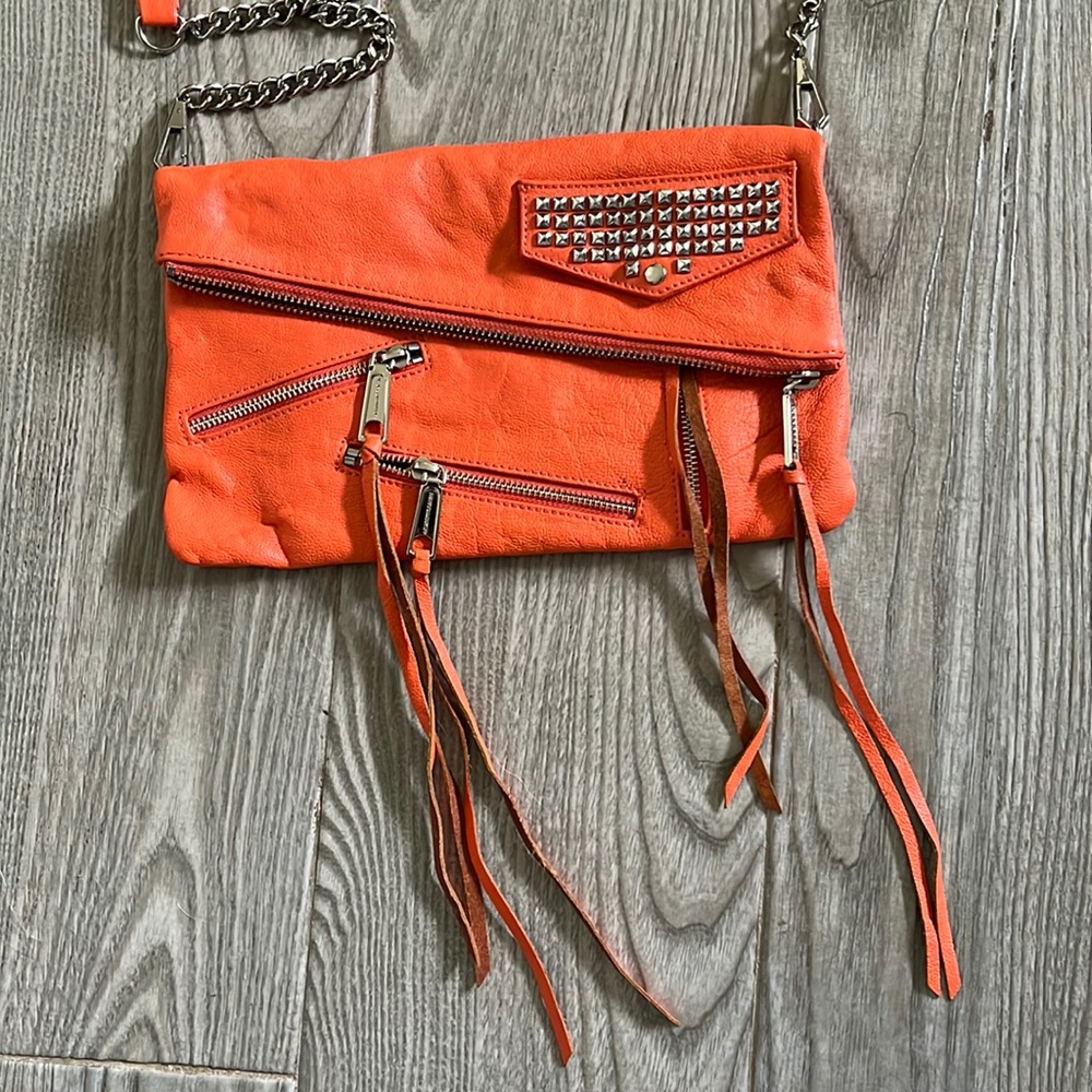 Rebecca Minkoff cross body orange bag.